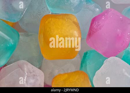 Colorful plastic ice cube blocks, closeup abstract background. Cold refreshing drink concept. Stock Photo