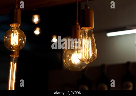 Light bulbs, lamps hanging on wires Stock Photo