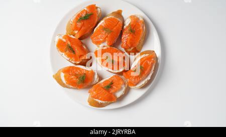 Open sandwiches with trout fillet ,wheat bread with butter and herbs Stock Photo