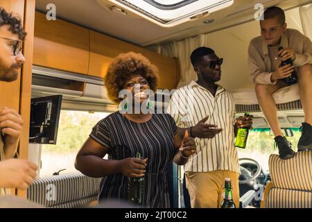 multiracial friends having fun in the van, friendship concept. High quality photo Stock Photo