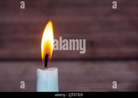 Candle light burning brightly with customizable space for text or ideas. Copy space. Stock Photo
