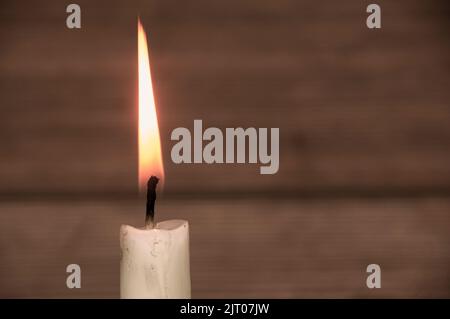 Candle light burning brightly with customizable space for text or ideas. Copy space. Stock Photo