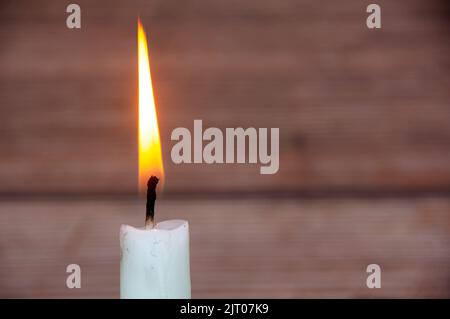 Candle light burning brightly with customizable space for text or ideas. Copy space. Stock Photo