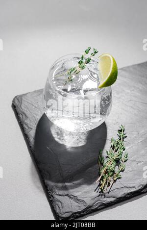 Strong seltzer cocktails with lime. Alcoholic cocktail tonic clear. hard seltzer is a low-alcohol drink consisting of alcohol, carbonated water and Stock Photo