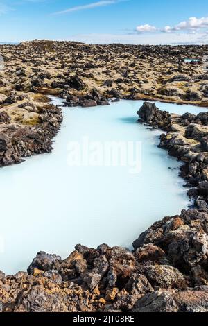 The milky blue waters from the geothermal power station that feed into the Blue Lagoon spa, Iceland. Stock Photo