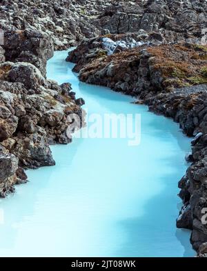 The milky blue waters from the geothermal power station that feed into the Blue Lagoon spa, Iceland. Stock Photo