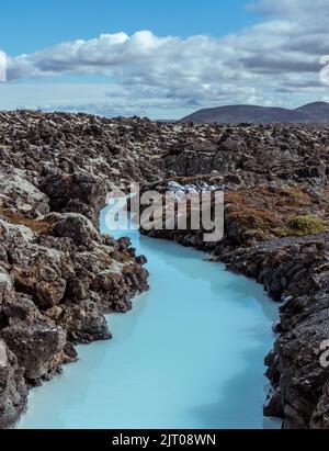 The milky blue waters from the geothermal power station that feed into the Blue Lagoon spa, Iceland. Stock Photo