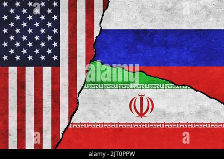 USA, Russia and Iran painted flags on a wall with a crack. United States of America, Iran and Russia relations Stock Photo