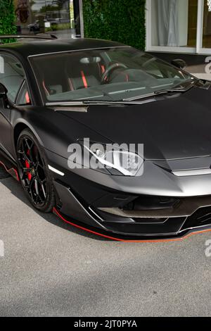 A matte black Lamborghini Aventador SVJ luxury car Stock Photo