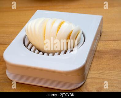 Household device for slicing eggs. Hard-boiled eggs slicer tool Stock Photo  - Alamy