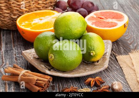 lime on a plate on wood background Stock Photo