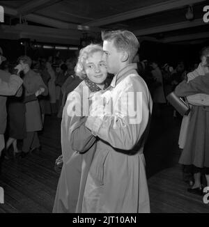 Dancing in the 1950s. A young couple is dancing and moving to the music on an outdoor dance floor.  Sweden 1953 Conard ref 2402 Stock Photo