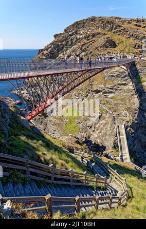 The Tintagel Bridge opened in 2019 connects the mainland with the island where the Arthurian Legend of Camelot was imagined. Tintagel castle, Cornwall Stock Photo