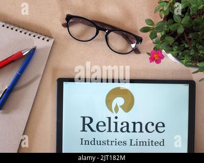 In this photo illustration,  Reliance Industries Limited logo seen displayed on a tablet Stock Photo