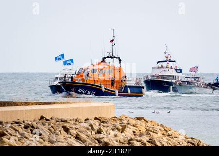 Sovereign Harbour, Eastbourne, UK. 27th Aug, 2022. Earlier today a flotilla of small boats including the RNLI All Weather lifeboat Diamond Jubilee sailed from Eastbourne's Sovereign Harbour to the Sovereign lighthouse just 11km off shore. The once manned lighthouse was commissioned in 1971 serving mariners for over 50 years. Lighthouse men left the platform in 1994 following its automation. Having now reached the end of its predicted life the structure is to be removed for safety reasons. Credit: Newspics UK South/Alamy Live News Stock Photo