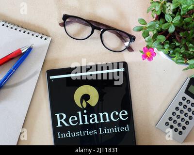 In this photo illustration,  Reliance Industries Limited logo seen displayed on a tablet Stock Photo