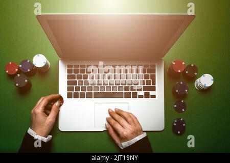 Top view of cropped woman hands using laptop for online casino. Concept virtual leisure activity. Stock Photo