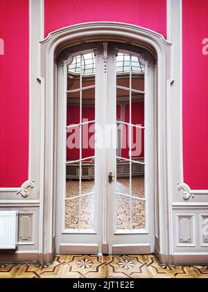 Classic style white interior wooden doors with mirrors Stock Photo