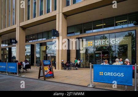 Greggs Bakery - Greggs Cafe and Food Store at Cambridge Station Square, Cambridge UK. Stock Photo