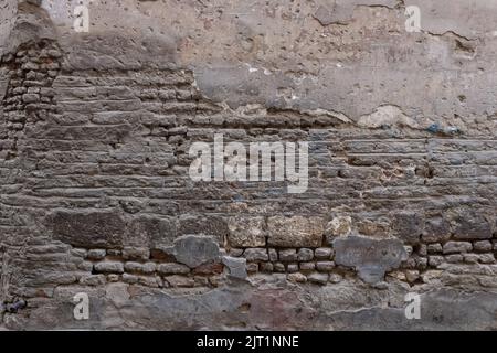 High Quality Old Damaged stone and Brick Dirty wall Stock Photo