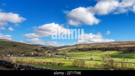 Panoramic view of Kettlewell village in the Yorkshire Dales National Park. General view of fields and barns in the landscape. North Yorkshire, UK