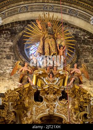 God represented at the top of the high altarpiece at the  Iglesia Colegial del Divino Salvador, Seville