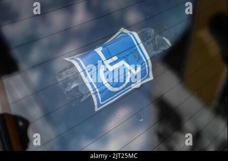 The International Symbol of Access (ISA), also known as the (International) Wheelchair Symbol on car window in Cali, Colombia Stock Photo