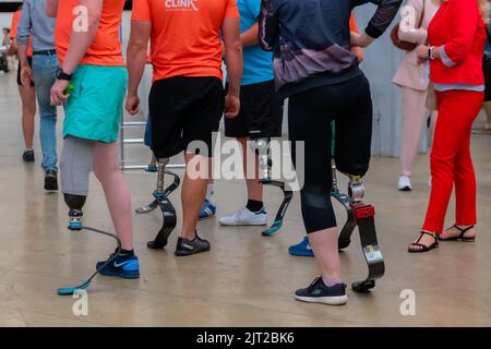 Group of disabled people with leg prosthesis at sport competition Stock Photo