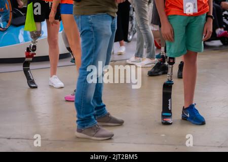 Group of people standing at competition for disabled persons with leg prosthesis Stock Photo