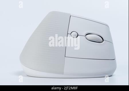 Modern ergonomic mouse with scroll button isolated on studio background Stock Photo