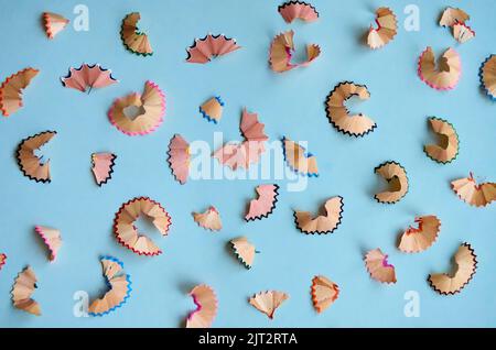 Many color pencils peels pattern isolated on white background, flatlay. Stock Photo