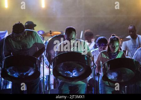 London, UK. 27th Aug, 2022. Panorama of Steeel Pan Orchestras at Notting Hill Carnival where steel orchestras vie for victory at Hornimans Pleasance, off Ladbroke Grove. Ebony, Pan Nation UK, Mangrove, Comets and The Croydon Steel Orchestra took part. Credit: Peter Hogan/Alamy Live News Stock Photo