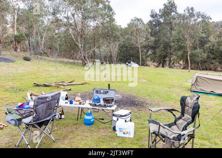 Australian campsite with chairs tents and cooking equipment, Abercrombie river national park,NSW,Australia winter 2022 Stock Photo