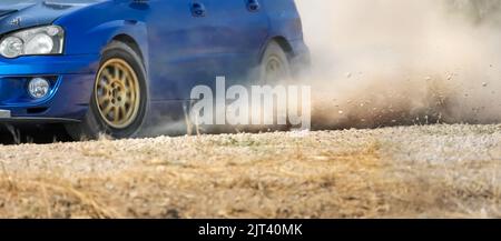 Rally racing car on dirt track. Stock Photo