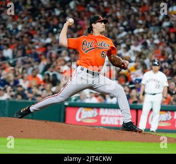 BALTIMORE, MD - JULY 04: Baltimore Orioles starting pitcher Dean Kremer  (64) turns and throws to first during a MLB game between the Baltimore  Orioles and the Texas Rangers, on July 04