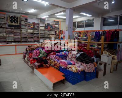 Manali Himachal Pradesh, India – February 20, 2014 : woolen clothes store, dress material shop for winter. Stock Photo