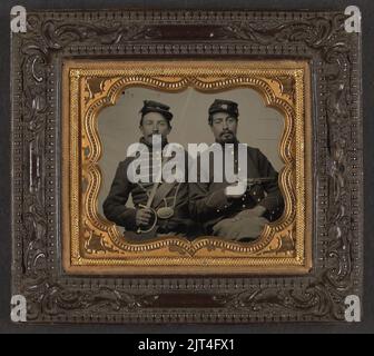 Two unidentified soldiers in Union uniforms, one wearing musician's uniform and holding Model 1840 musician's sword, the other holding Colt Model 1851 Navy revolver Stock Photo