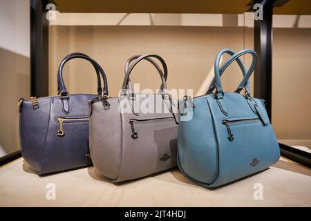 SINGAPORE - CIRCA JANUARY, 2020: bags on display at Coach store in Singapore Changi Airport. Stock Photo