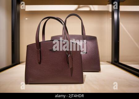 SINGAPORE - CIRCA JANUARY, 2020: bags on display at Coach store in Singapore Changi Airport. Stock Photo