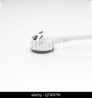 A pediatric stethoscope with interchangeable animal heads on a white background Stock Photo