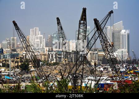 Beirut, Lebanon: The skyscrapers of modern downtown Beirut can be seen behind cranes and the debris from the massive explosion that devastated 2,750 tons of ammonium nitrate stored in the city's port on 8/4/2020 Stock Photo