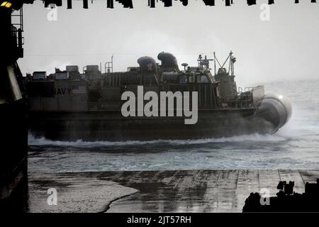 Landing Craft Unit departs the well deck of the amphibious assault ship ...