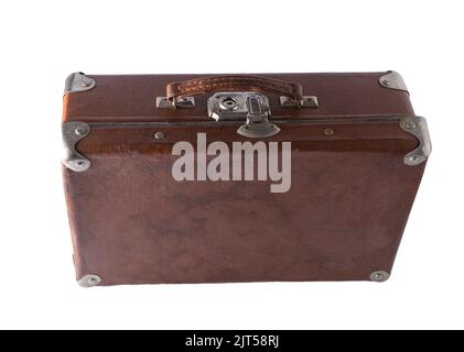 Old suitcase isolated on white background. Brown leather vintage suitcase with metal brackets on the corners and a lock. Baggage. Stock Photo