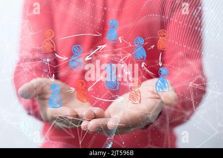 A businessman holding a floating digital render of people icons, a global network concept Stock Photo