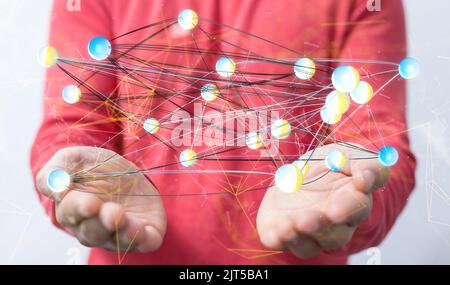 A man holding a floating 3D rendering of futuristic lines of digital network Stock Photo