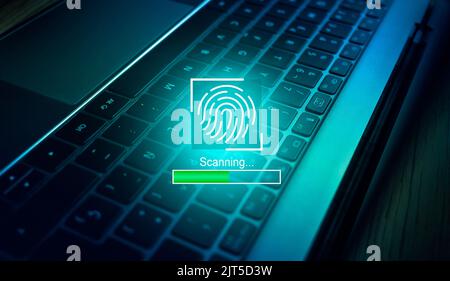 Biometric authentication concept. fingerprint scanning with laptop keyboard as background. Access password thru fingerprints. Stock Photo