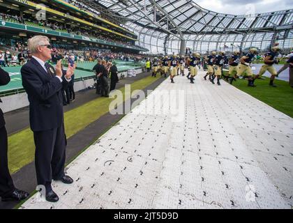 U.S. Secretary of the Navy Ray Mabus, left, observes as players warm up before the start of the NCAA Emerald Isle Classic college football season opener game between the University of Notre Dame and the Navy 120901 Stock Photo