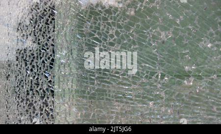 Strained glass broken window from explosion splinter. Shattered glass. Abstract blurred defocused broken glass texture background. Abstract background Stock Photo