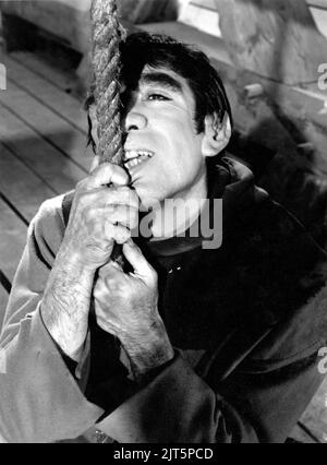 ANTHONY QUINN as Quasimodo in THE HUNCHBACK OF NOTRE DAME / NOTRE DAME DE PARIS 1956 director JEAN DELANNOY novel Victor Hugo adaptation / dialogue Jean Aurenche and Jacques Prevert music Georges Auric costume design Georges Benda production design Rene Renoux choreographer Leonid Massine producers Raymond and Robert Hakim France - Italy co-production Paris Film Productions / Panitalia Stock Photo