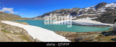 Panoramic view to the Langvatnet lake along the Rv15 Gamle Strynefjellsveg in Norway between Stryn and Grotli in Summer Stock Photo